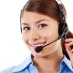 Female call center agent with headset smiling in professional attire supporting B & D Plumbing, Heating & A/C services.