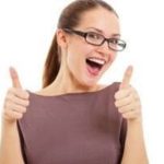 Cheerful young woman in glasses giving thumbs up, promoting B & D Plumbing's garbage disposal guide for homeowners.