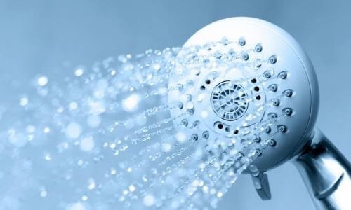 Showerhead with sleek design and water streams, part of B & D Plumbing's residential services.