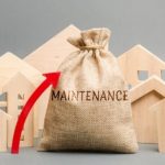 Burlap sack labeled "MAINTENANCE" with wooden house figures, showcasing home upkeep for B & D Plumbing, Heating & A/C.