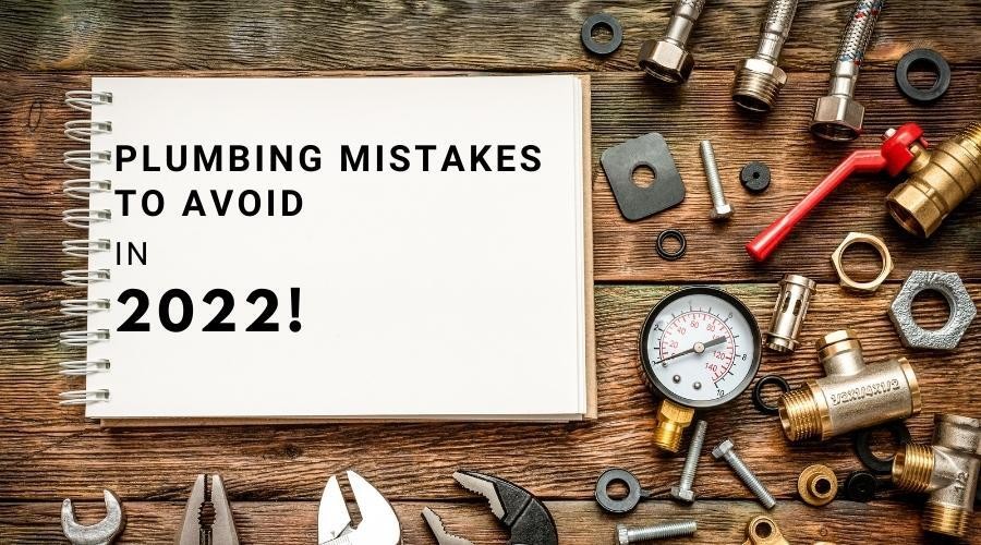 Open notebook about plumbing mistakes with tools on a workbench, featuring B & D Plumbing.