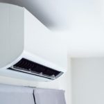 Sleek ductless air conditioning unit mounted on wall in minimalist living space by B & D Plumbing, Heating & A/C.
