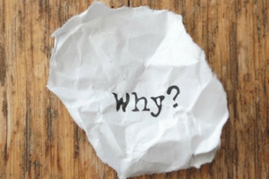 Crumpled paper with the word "Why?" emphasizing the importance of understanding air quality issues related to duct cleaning.